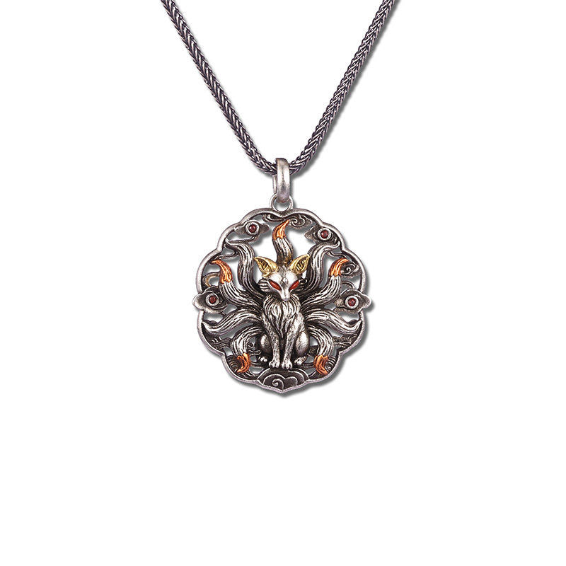 Nine-tailed fox copper pendant necklace with antiqued silver finish, gold-tipped nine tails, and red gemstone eyes on a dark oxidized metal chain — full product view on white background