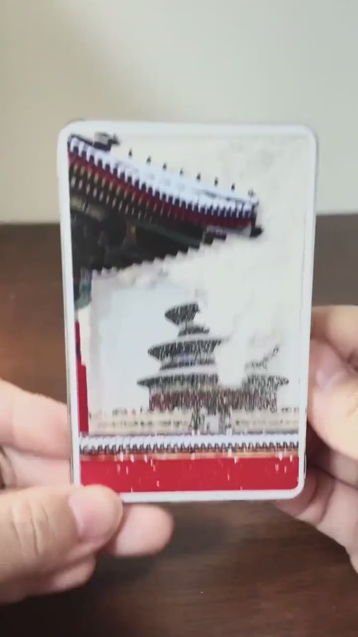 Video demonstration of shaking the Temple of Heaven magnet to see the peaceful falling snow effect.