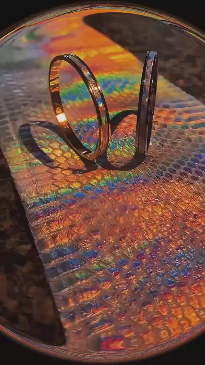 Tao Stones Python Leather Oval Bangle product showcase - featuring unique serpentine texture and easy-open clasp design in silver and gold finishes