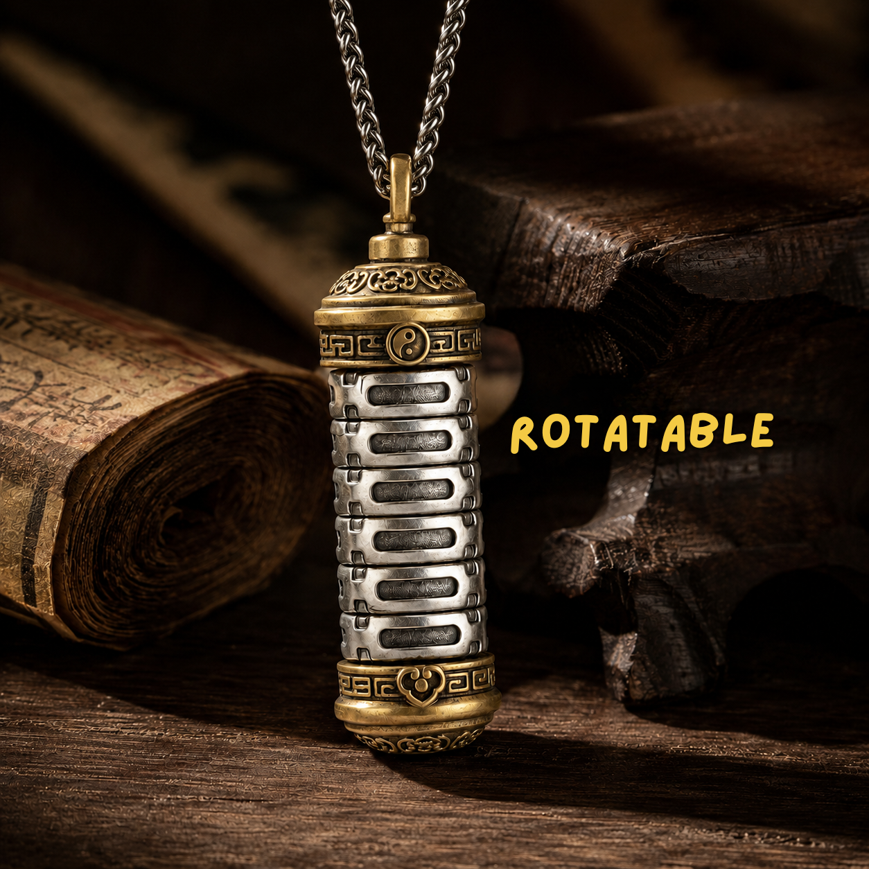 Close-up detail of the Revolving Mantra pendant's six rotatable silver segments engraved with Bagua trigram yao lines, brass yin-yang band, and ruyi motif on dark wood surface