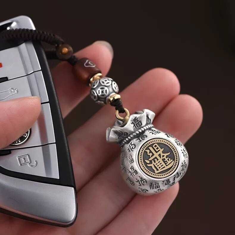 Tao Stones Infinite Abundance: Rotating Fortune Bag Wealth & Blessing Keychain